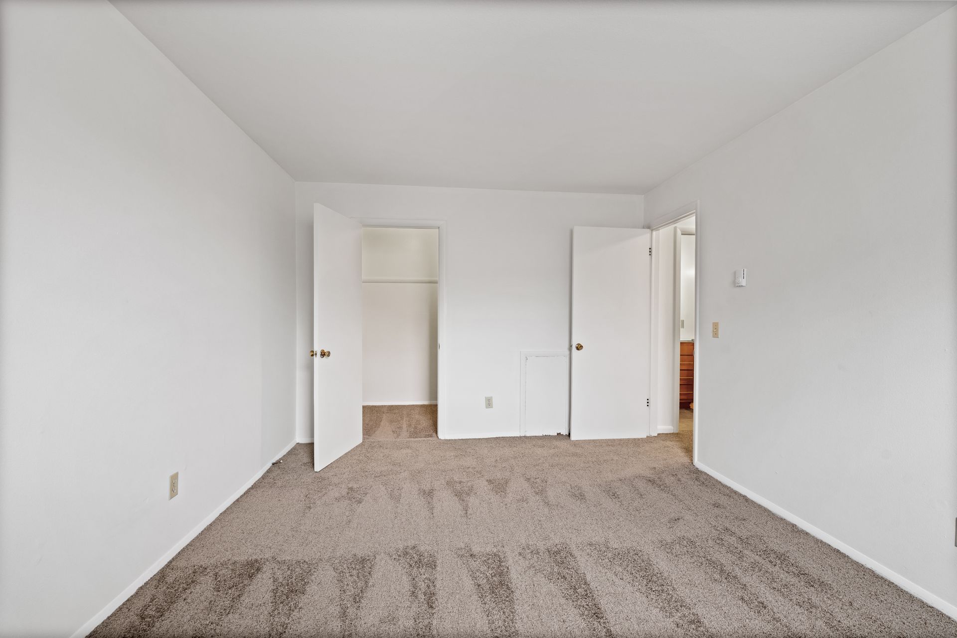 Photo of a bedroom with a walk-in closet