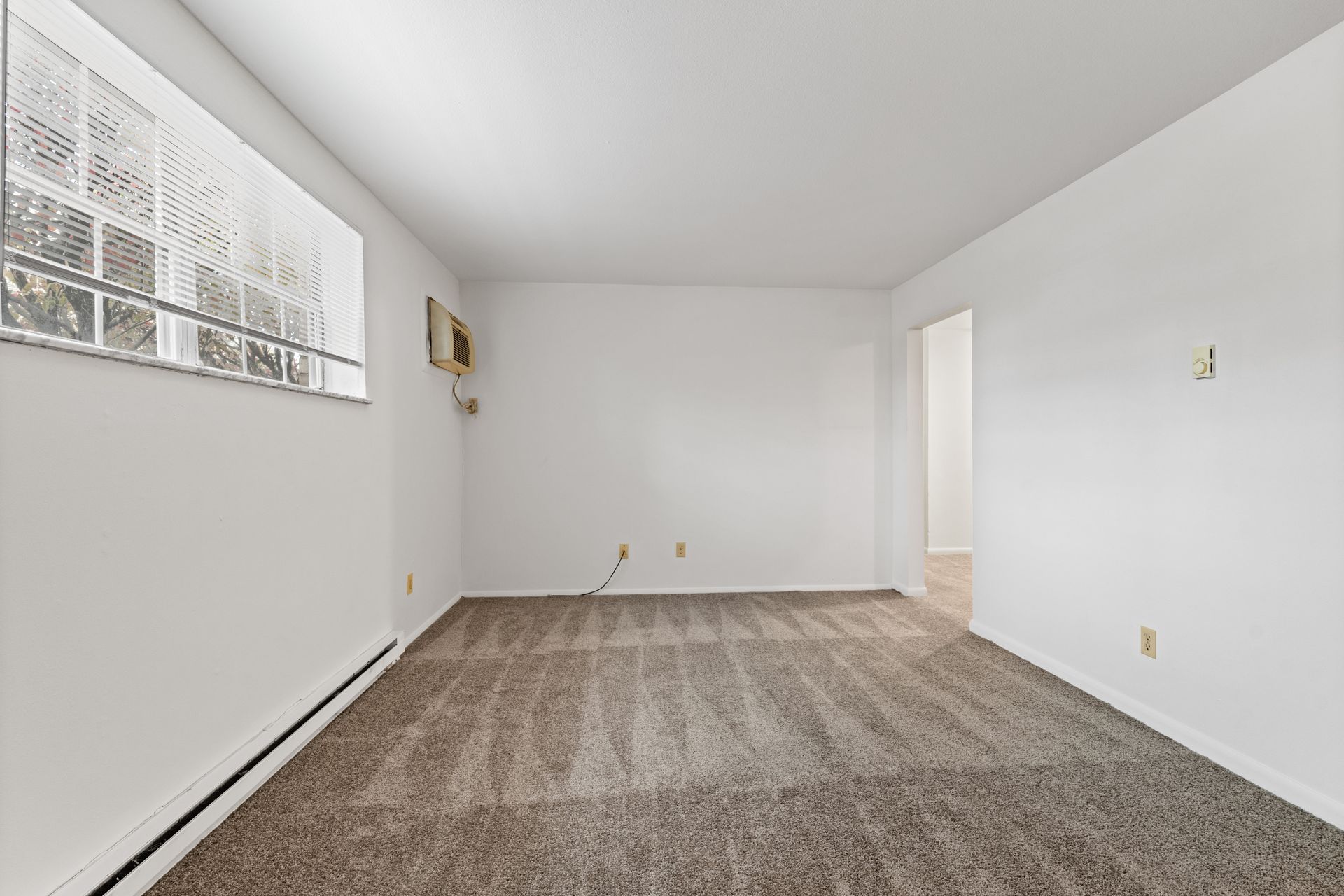 Photo of a den without furniture, to show the size of the room