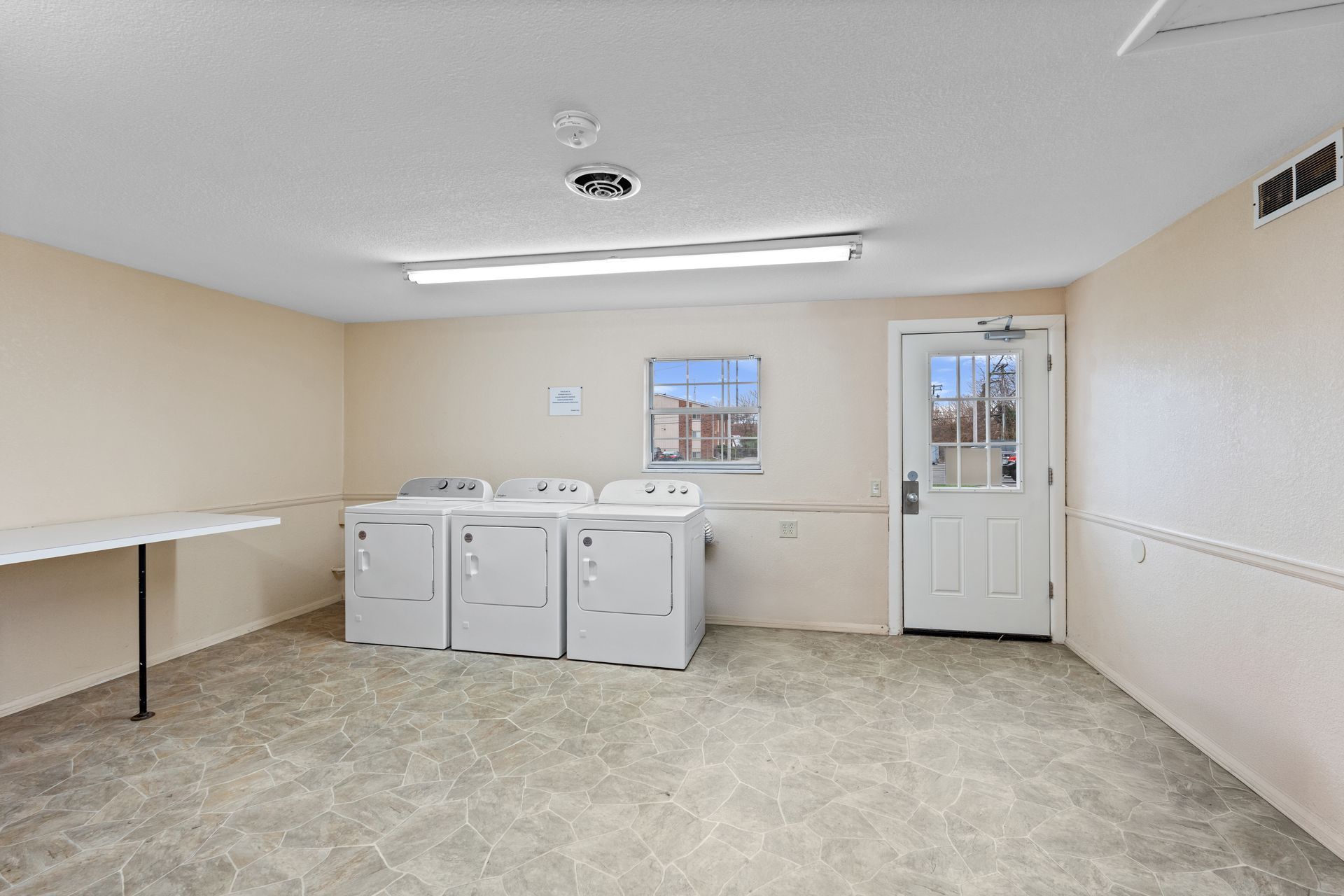 Photo of a laundry room with a folding table