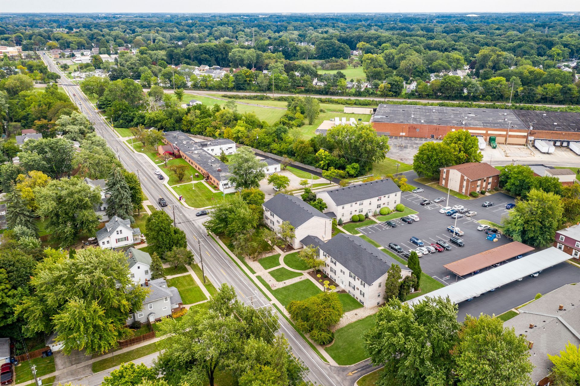 Photo of the community seen from a bird's eye point of view, with plenty of trees in the area