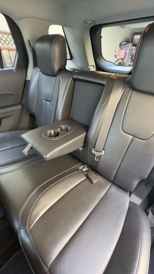 A close up of the back seat of a car.