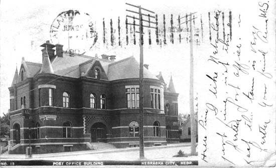 A black and white photo of a large brick building