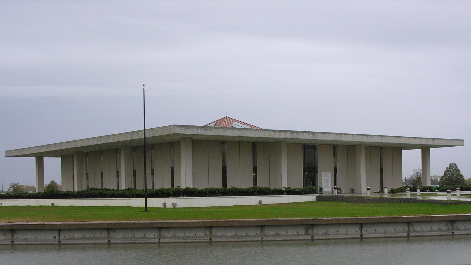 A large building with a flag on top of it