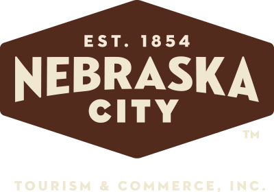 The logo for nebraska city tourism and commerce inc.