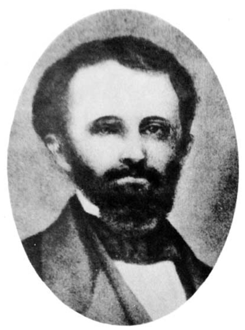 A black and white photo of a man with a beard