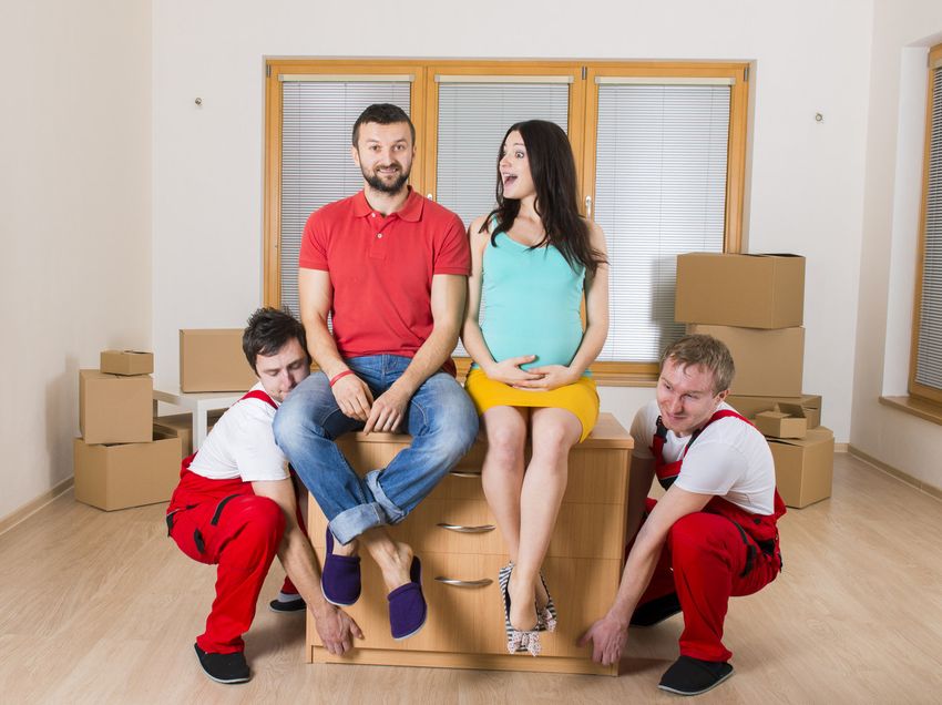 Movers lifting a Sideboard