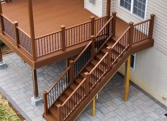 A wooden deck with stairs leading up to it
