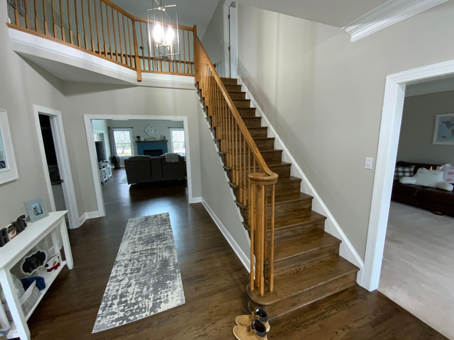 A wooden staircase leading up to the second floor of a house.