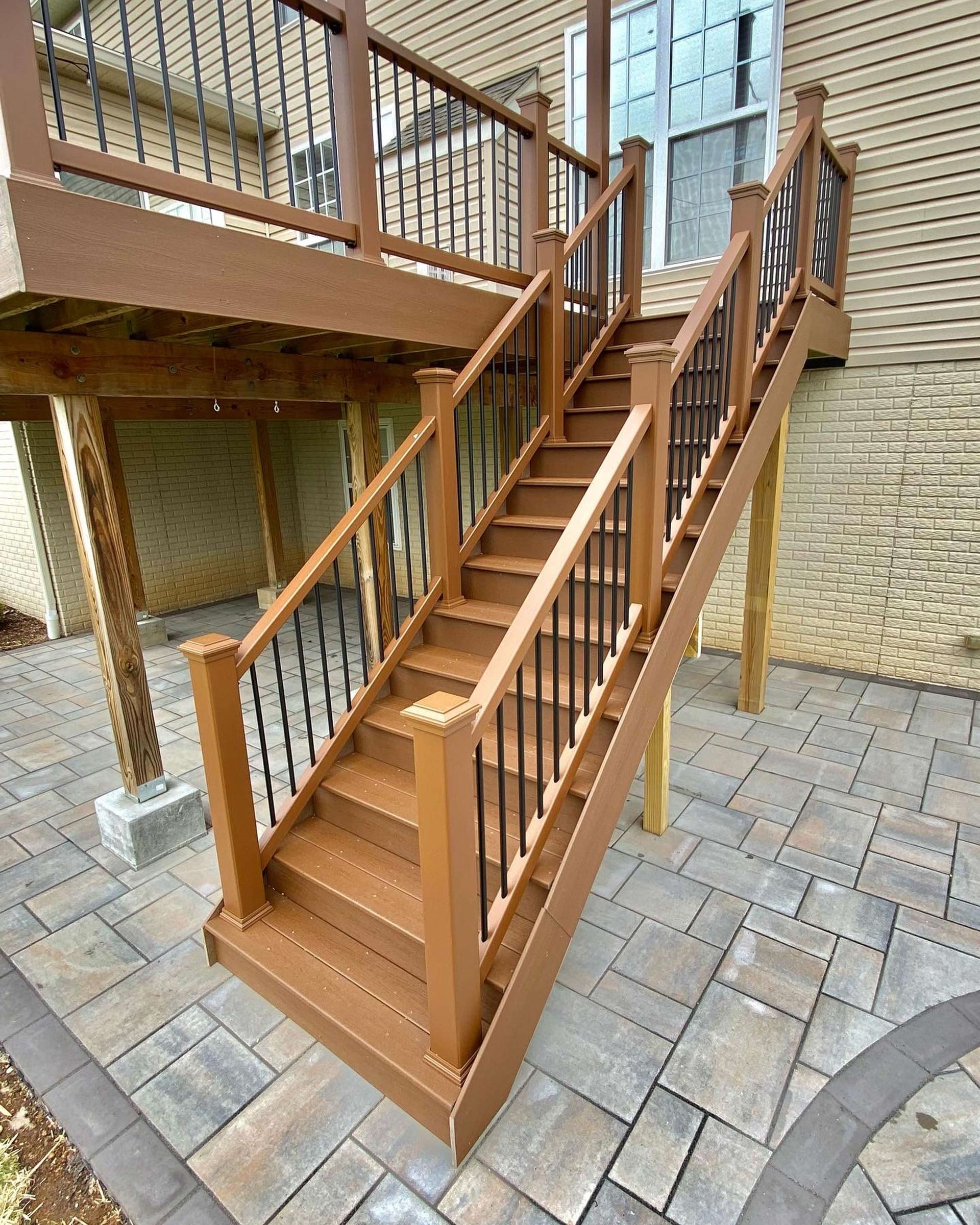 A wooden deck with stairs leading up to it.