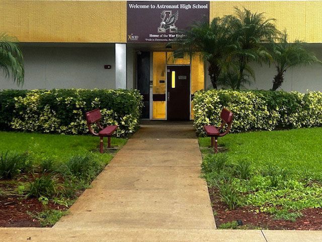 A walkway leading to the entrance of a high school