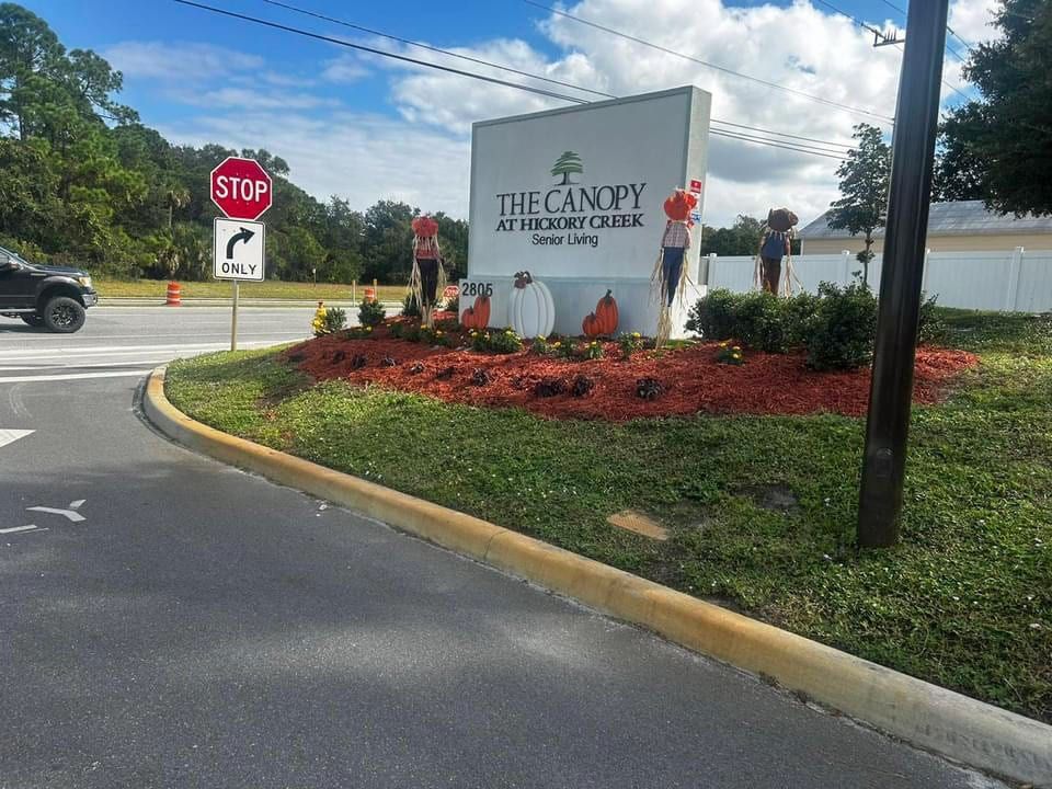 A stop sign is next to a sign that says the canopy