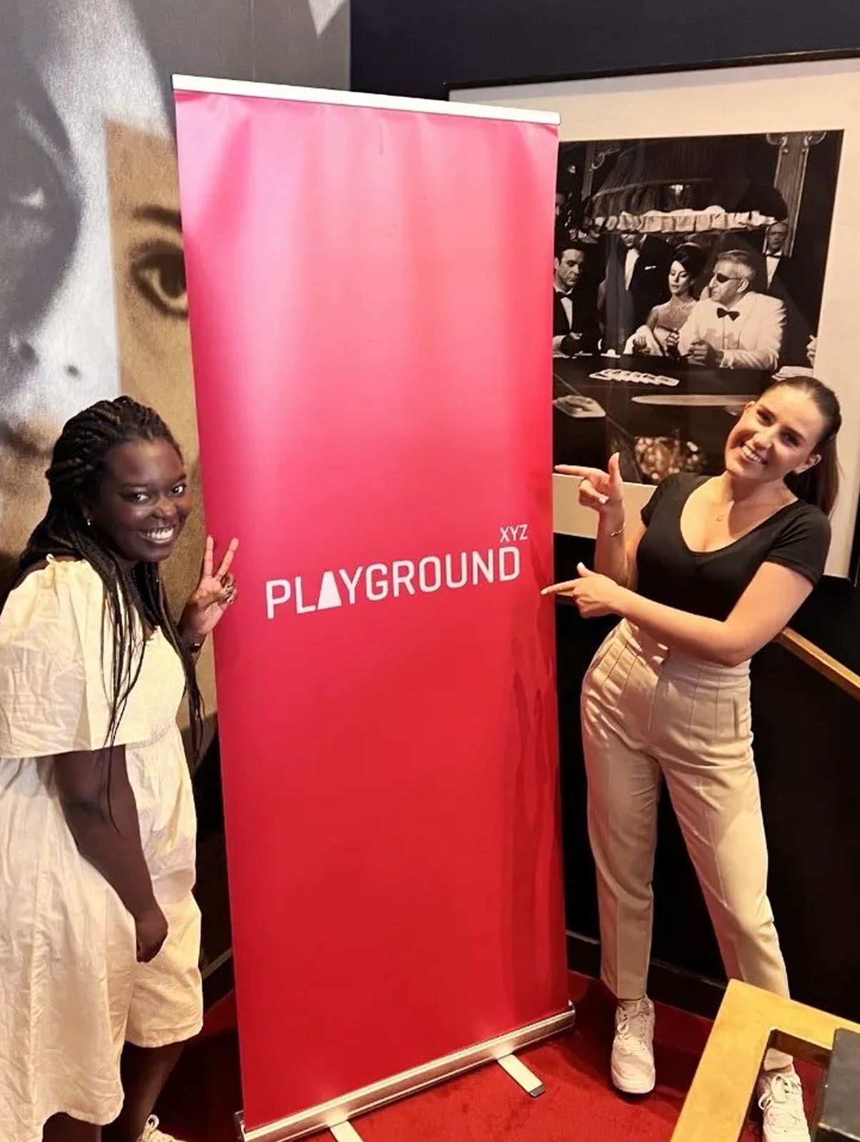 The Events team girls with a Playground xyz banner