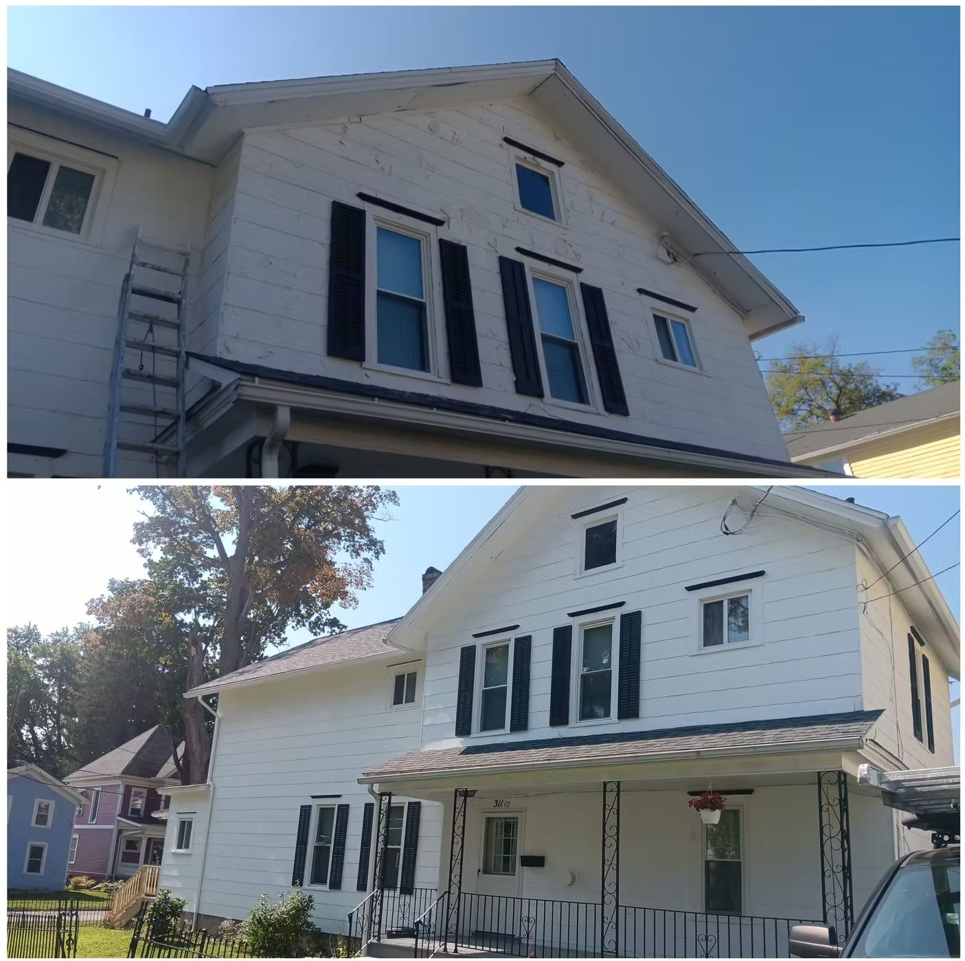 Two-story white house with black shutters, angled view, bright blue sky, ladder on side.