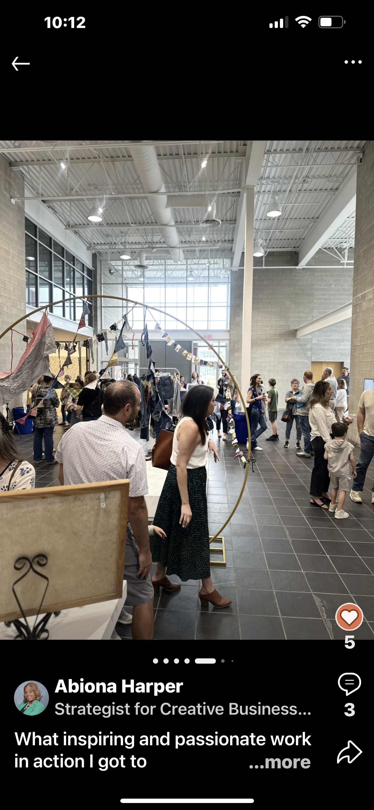 A group of people are standing in a room.