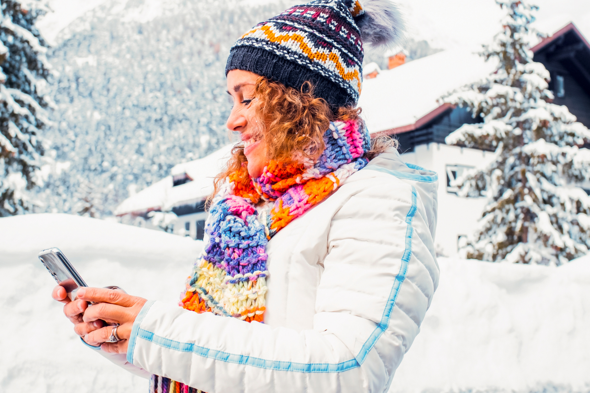 Woman Using Phone in Winter