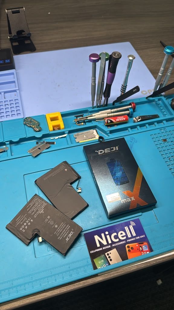Cell phone repair technician workspace at Nicell Cell Phone Repair South Salt Lake with repair tools