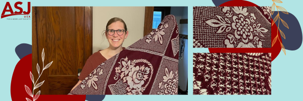 Jill Stoltzfus, former Executive Director of ASJ-US, with the tapestry blanket she purchased on her first trip to Honduras. 