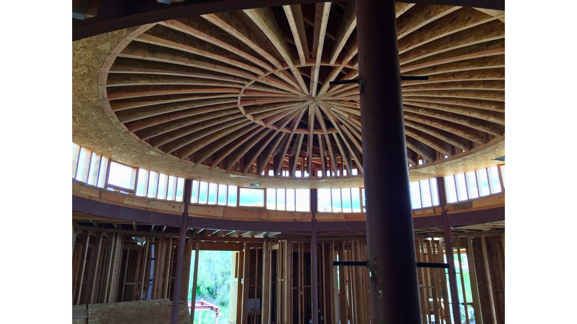 The inside of a building under construction with a circular ceiling.