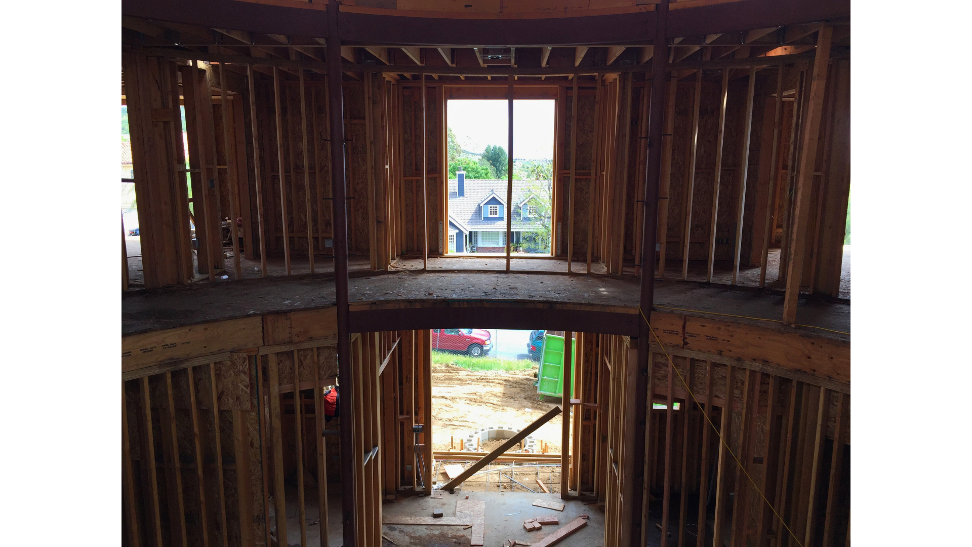 The inside of a building under construction with a large window.