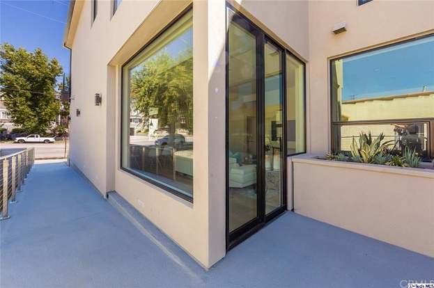 A building with a lot of windows and a sliding glass door