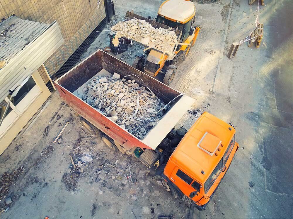 Dump Truck Picking Up Rubble — Carlisle, PA — Elwood B. Shughart & Sons Excavating