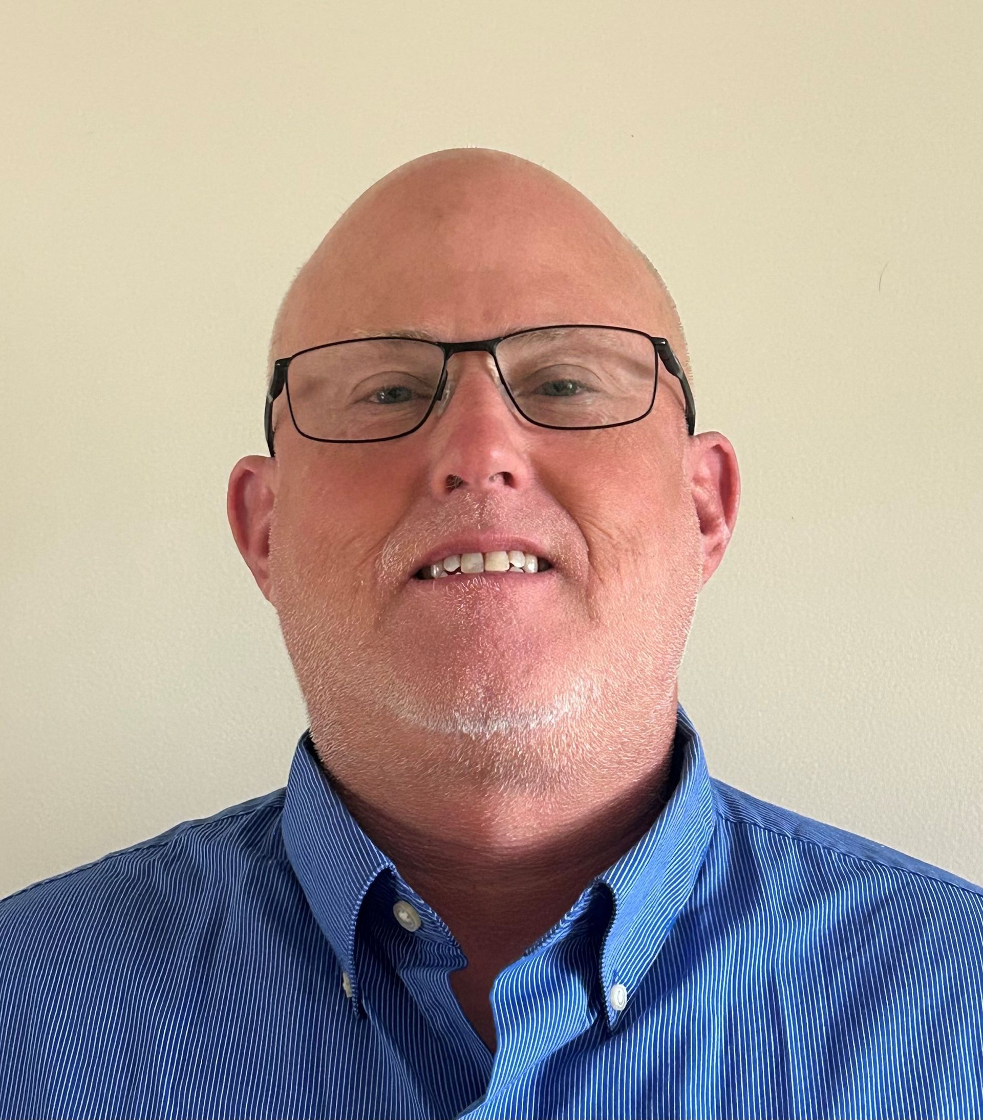 A coming soon sign with a picture of a mountain in a circle.