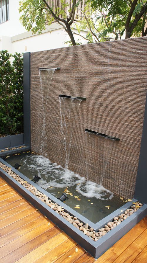 There is a waterfall in the middle of the wall.