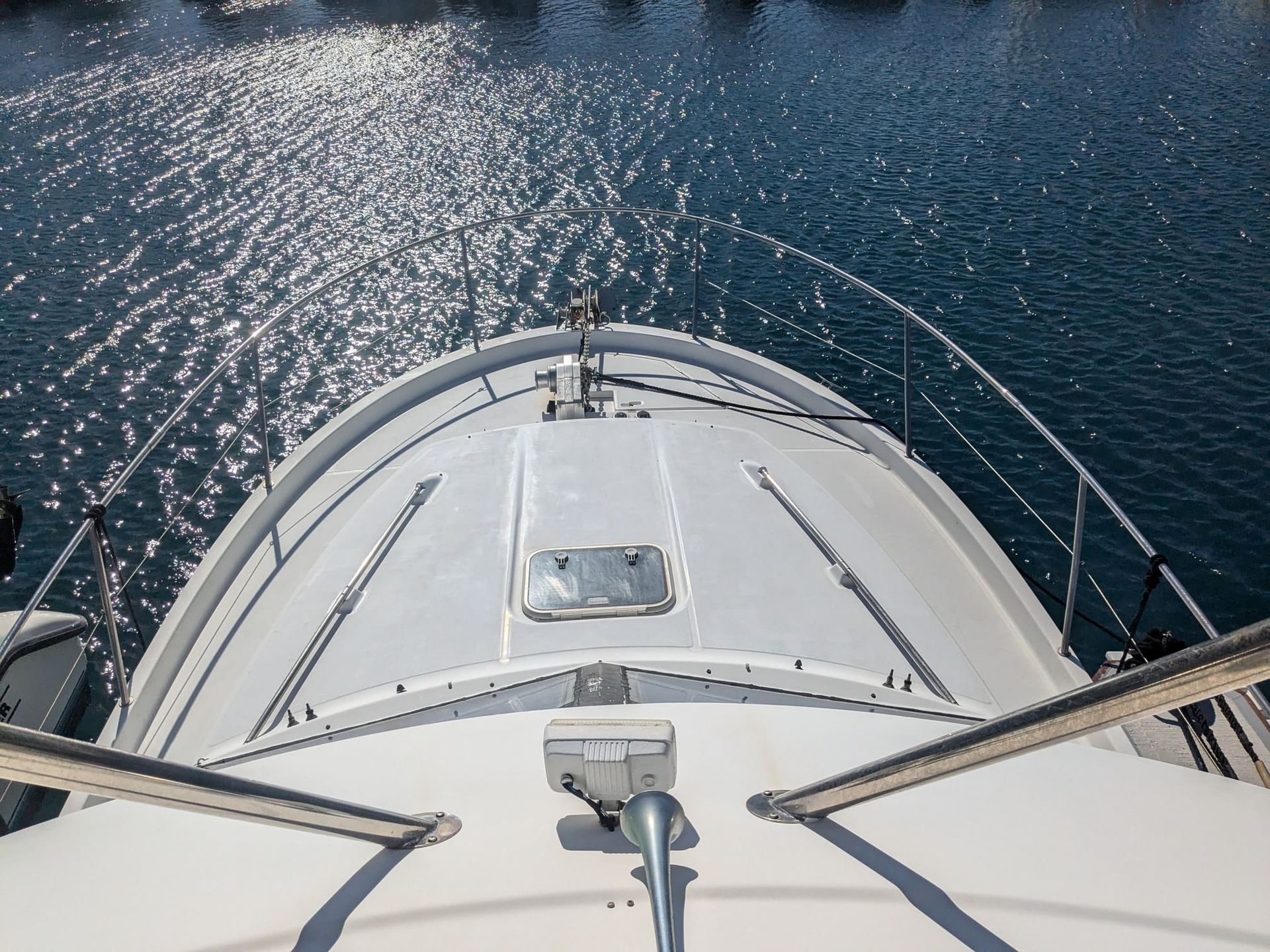 The front of a boat is visible in the water
