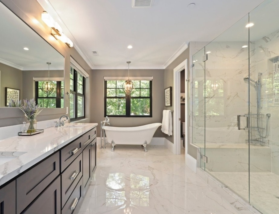 A bathroom with a glass block shower and a sink