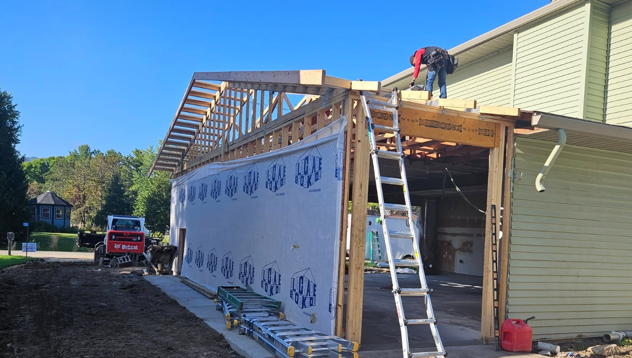 Builders working in the roof for a home improvement project in Holmen WI