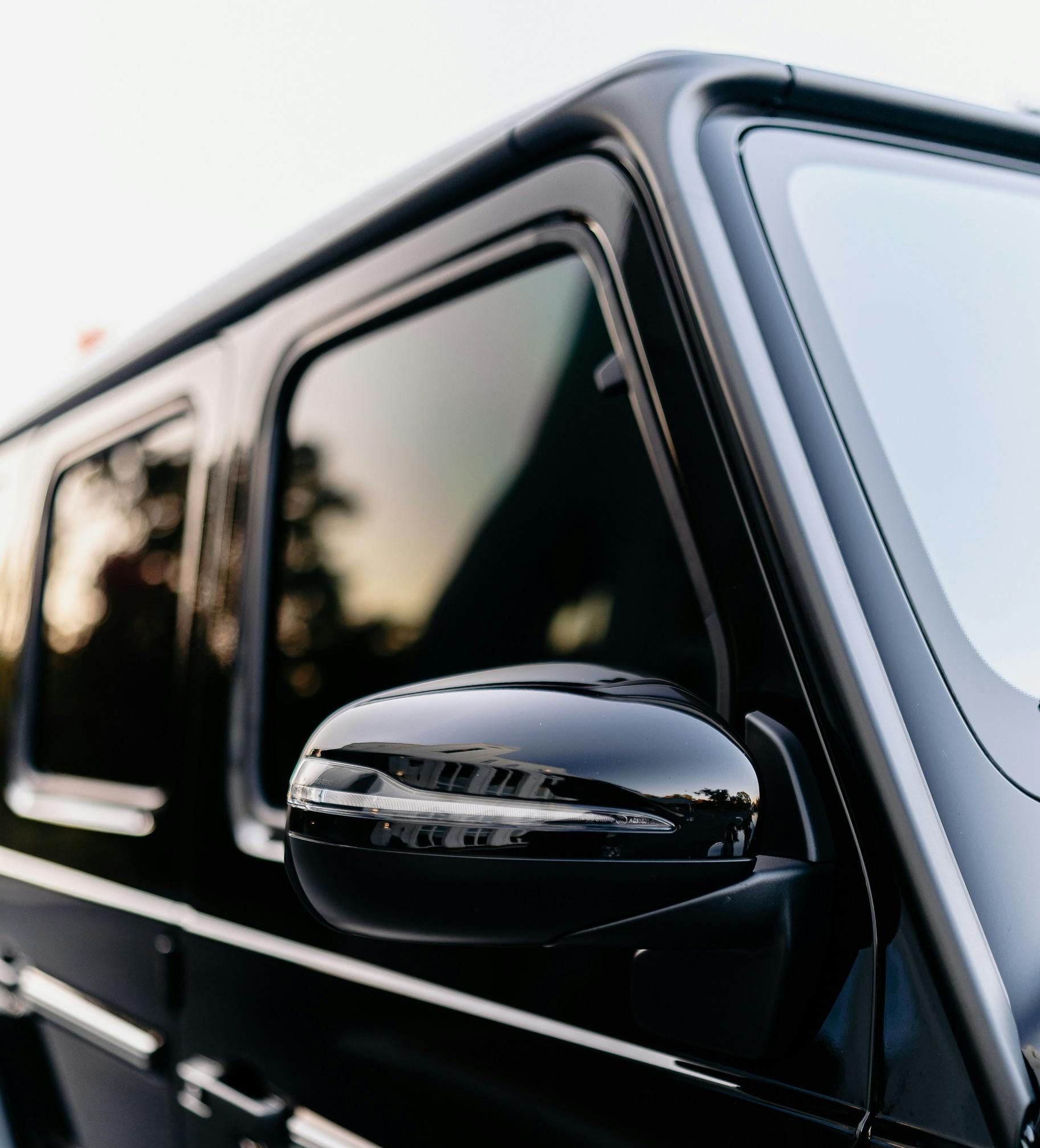 A tesla model x is parked in a parking garage.