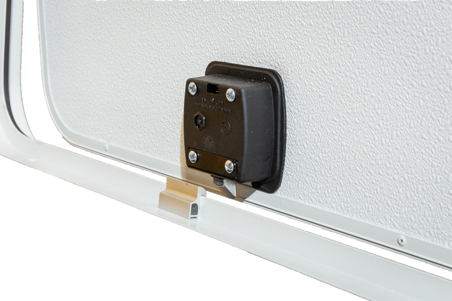 Close-up of a black latch mounted on a white metal door panel