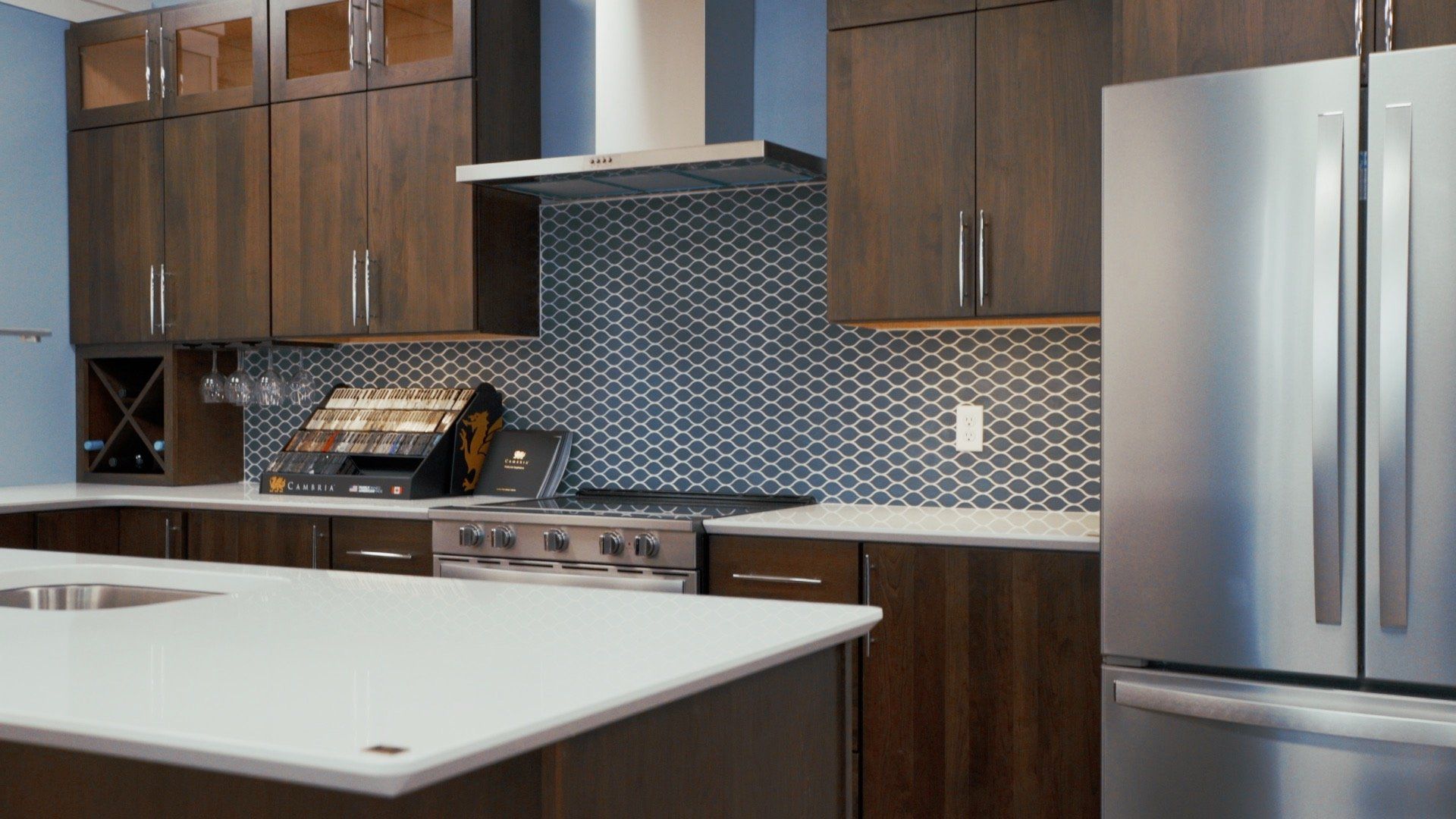 A kitchen with stainless steel appliances and wooden cabinets.