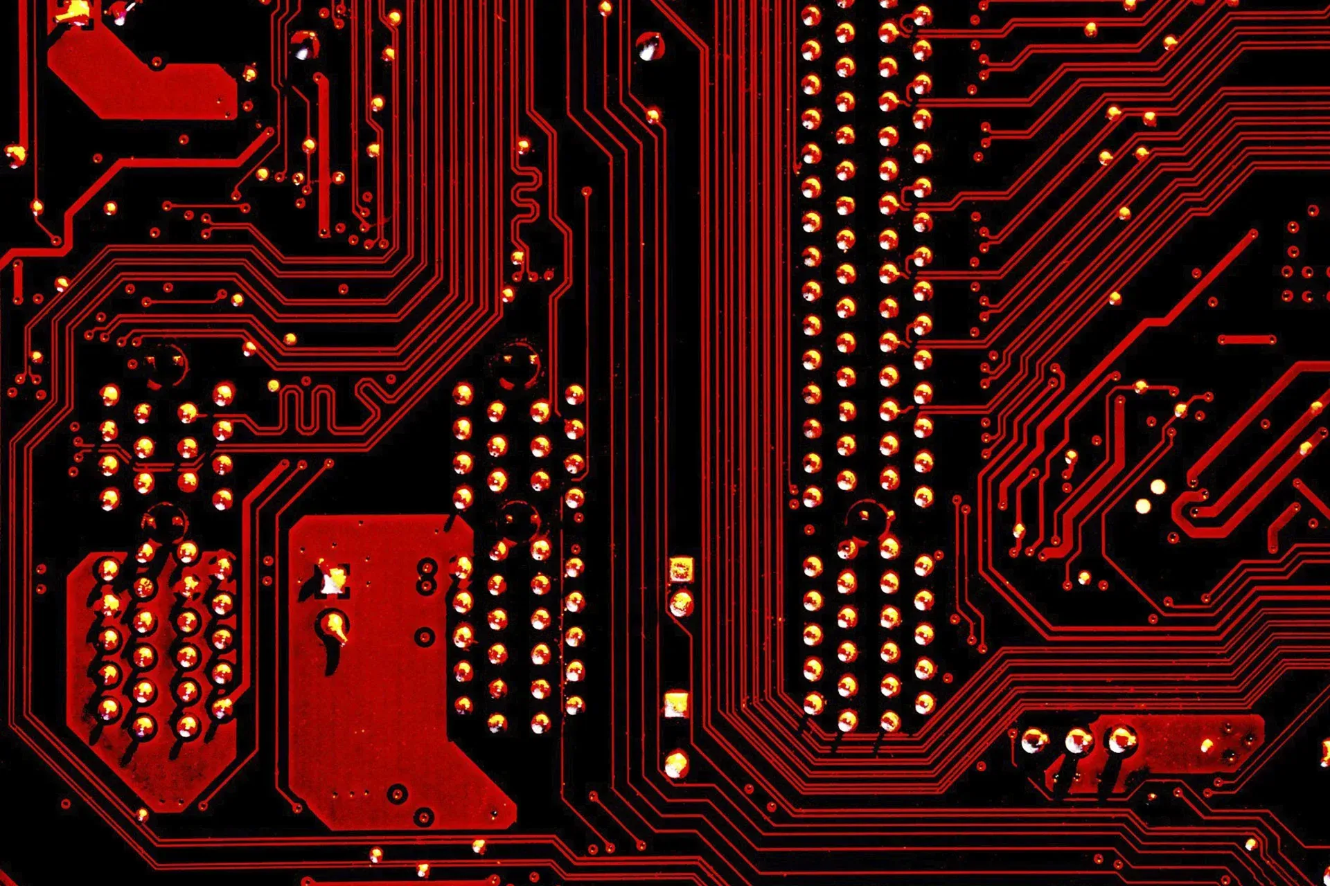 A close up of a red and black computer motherboard