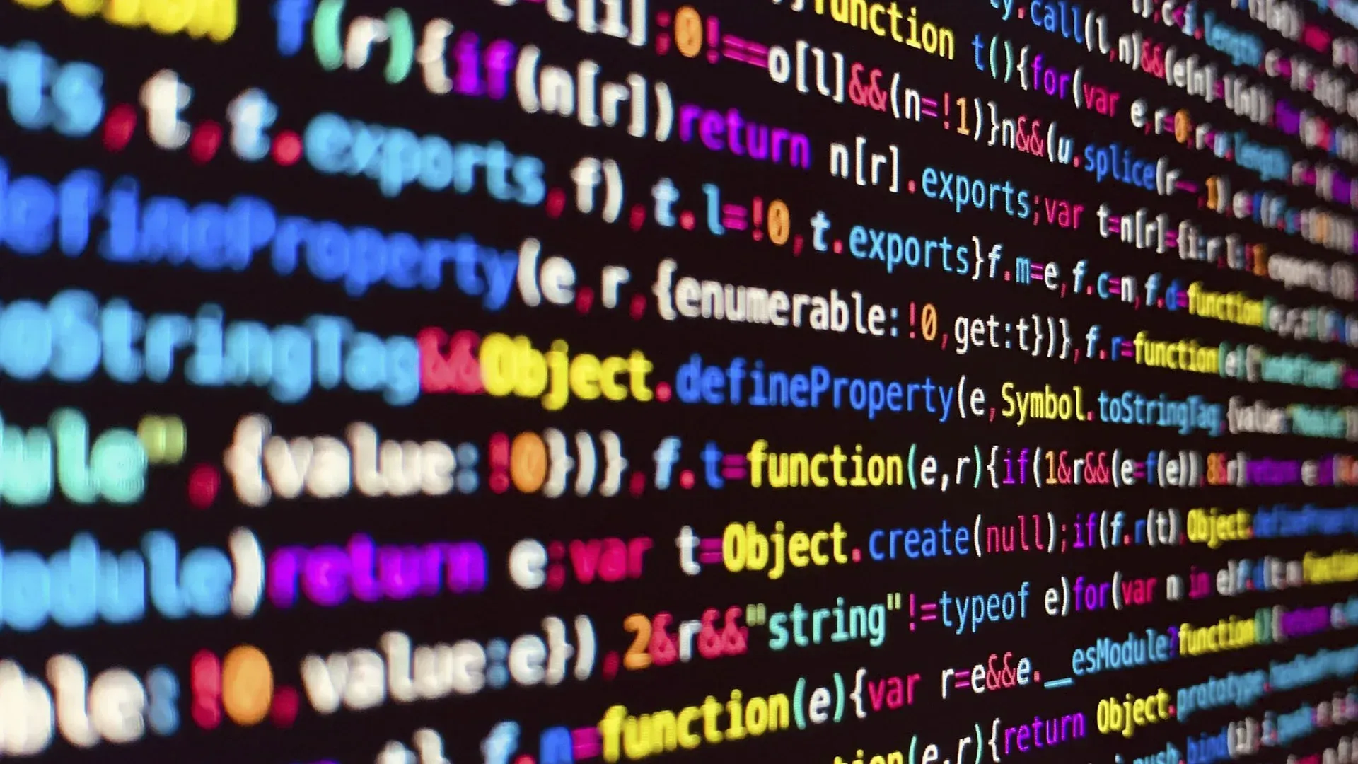 A close up of a computer screen with lots of colorful code