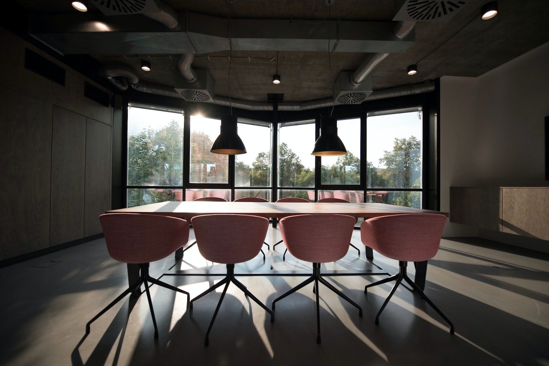 Boardroom table in front of a window