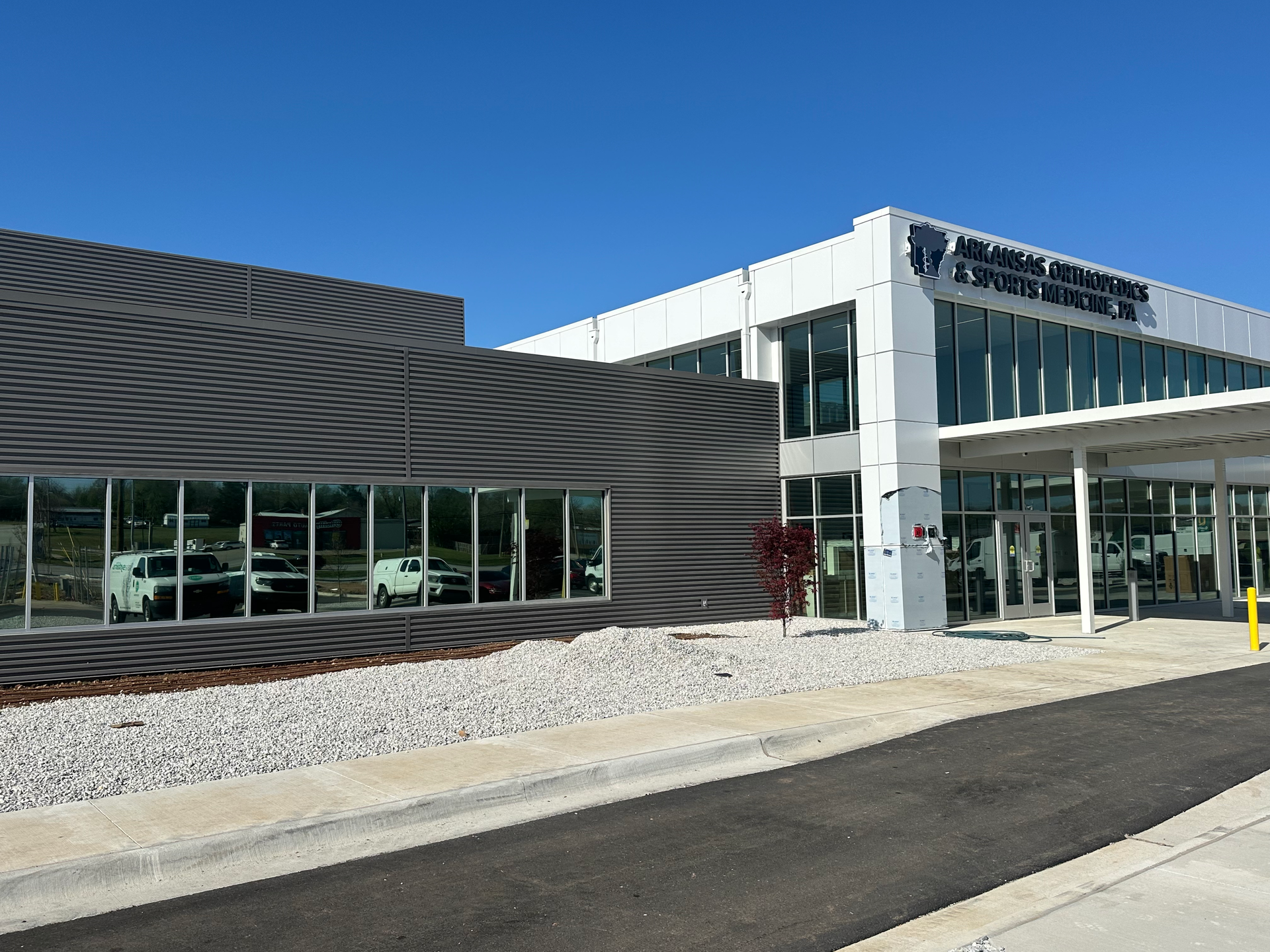 A large building with a sign that says associated orthopaedics