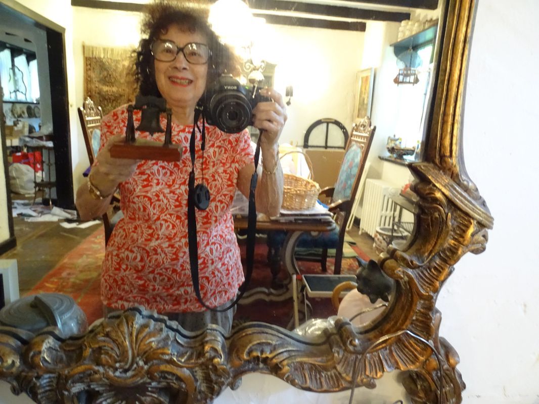 A woman is taking a picture of herself in a mirror