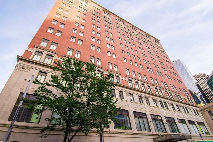 A violin is sitting on a wooden table.