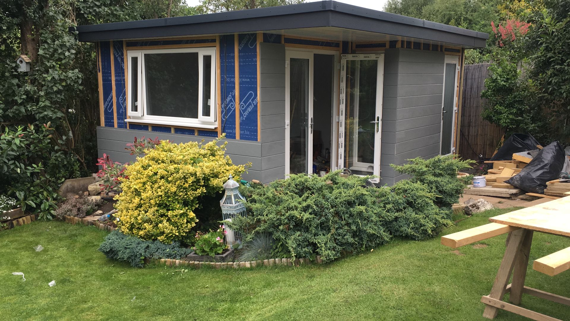 A small house is being built in a backyard.