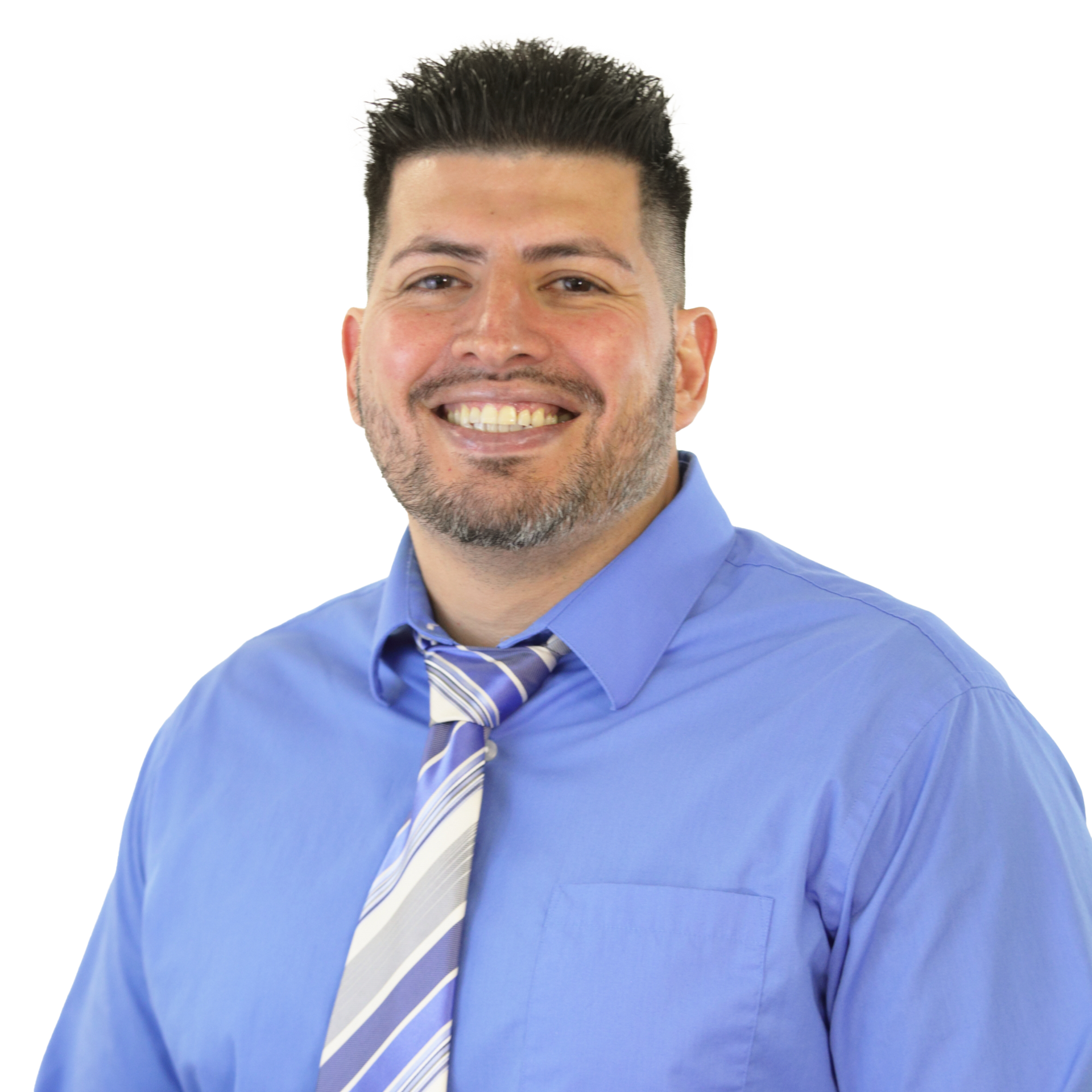Man smiling, wearing a blue shirt and striped tie. Against a white background.