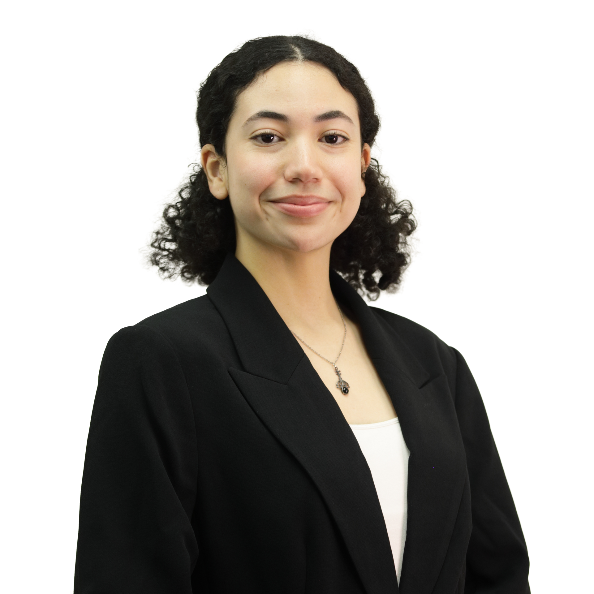 Woman in a black blazer and white top, smiling, posed against a white background.