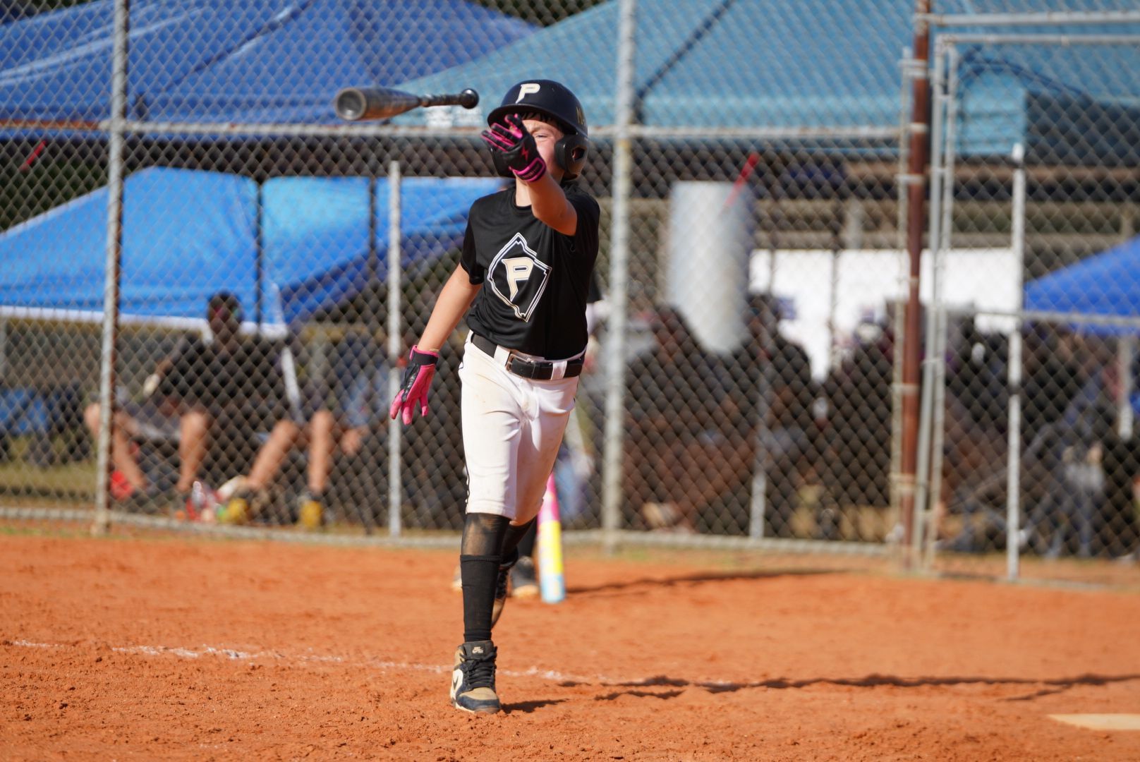 Prime Athletics athlete releasing a bat after a swing