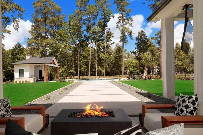 There is a fire pit in the middle of the patio.