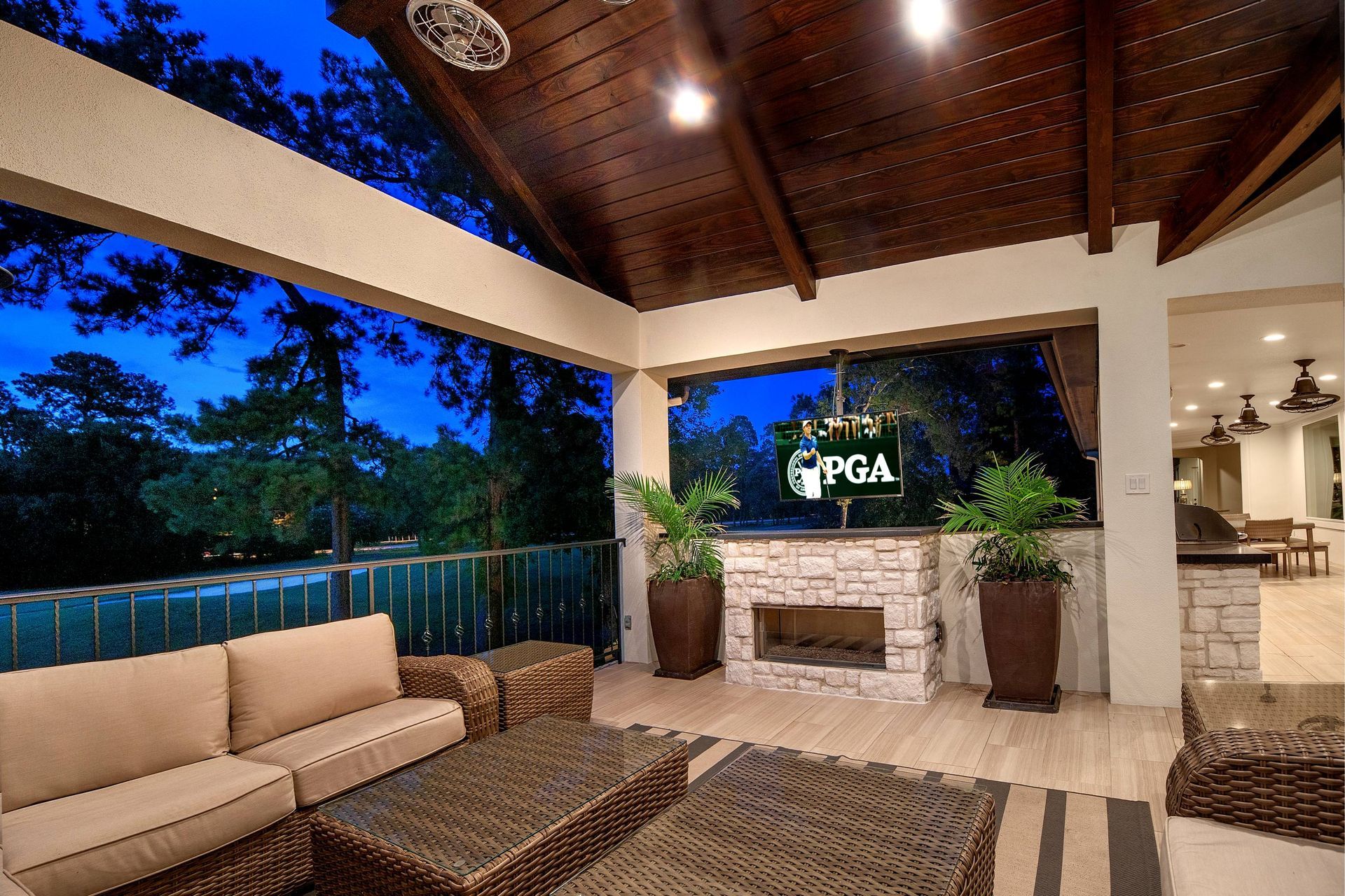 A living room with a fireplace and a sign that says pga
