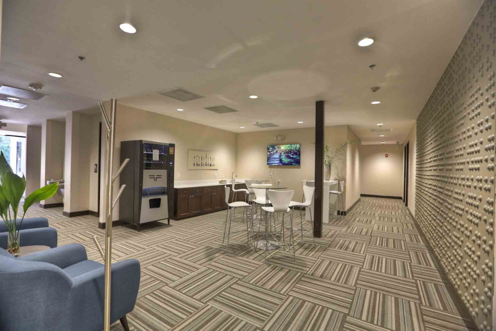 There is a coffee machine in the middle of the room.