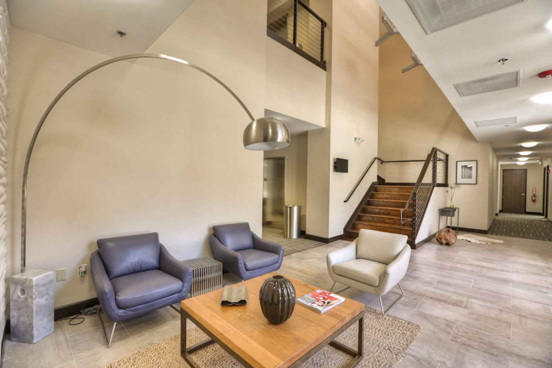 A living room with two chairs and a coffee table