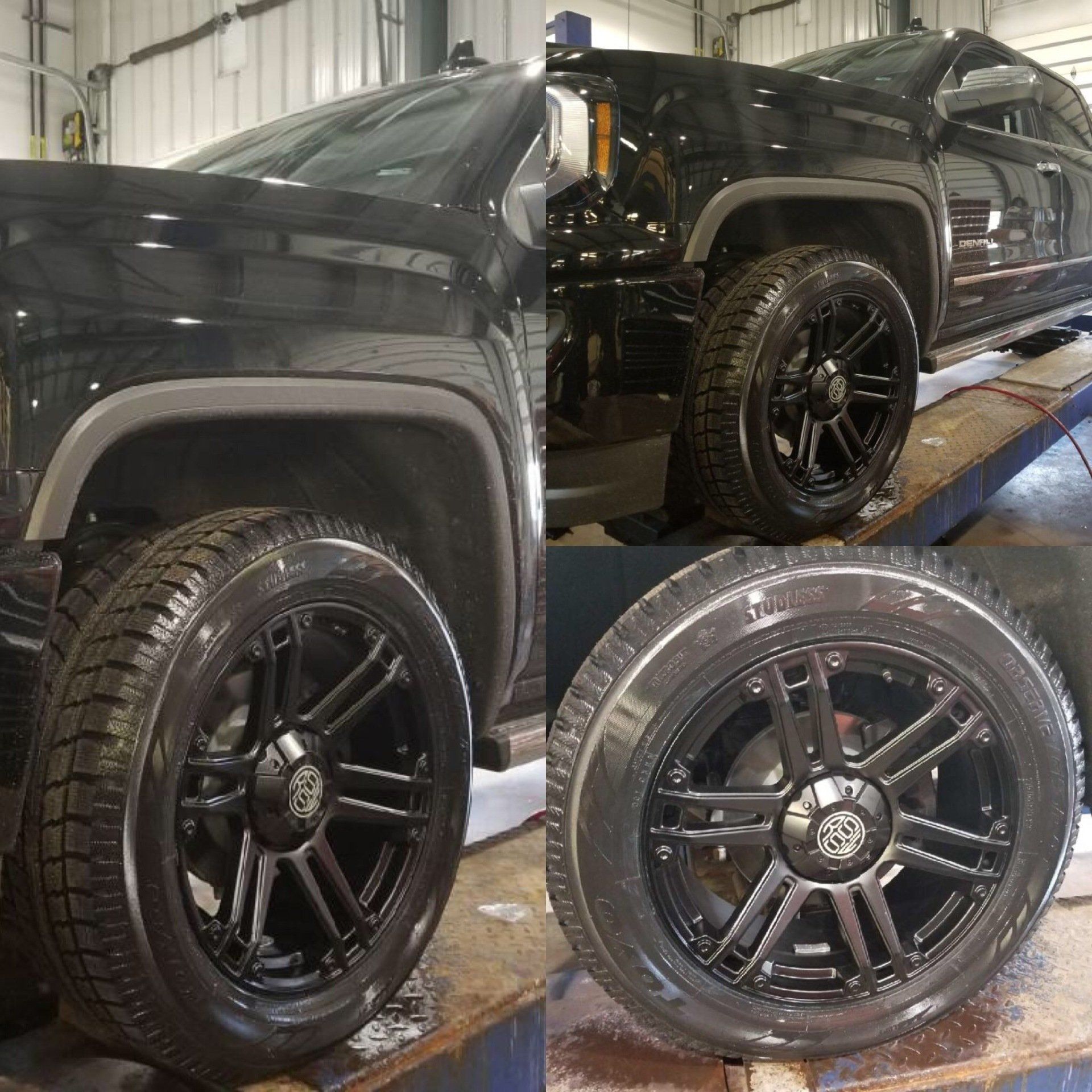 A black truck with black wheels and tires