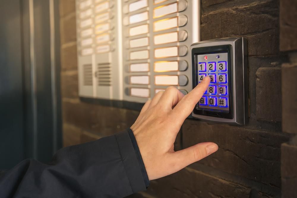 A Person Is Pressing a Button on A Keypad — MNC Security in Nambucca Heads, NSW