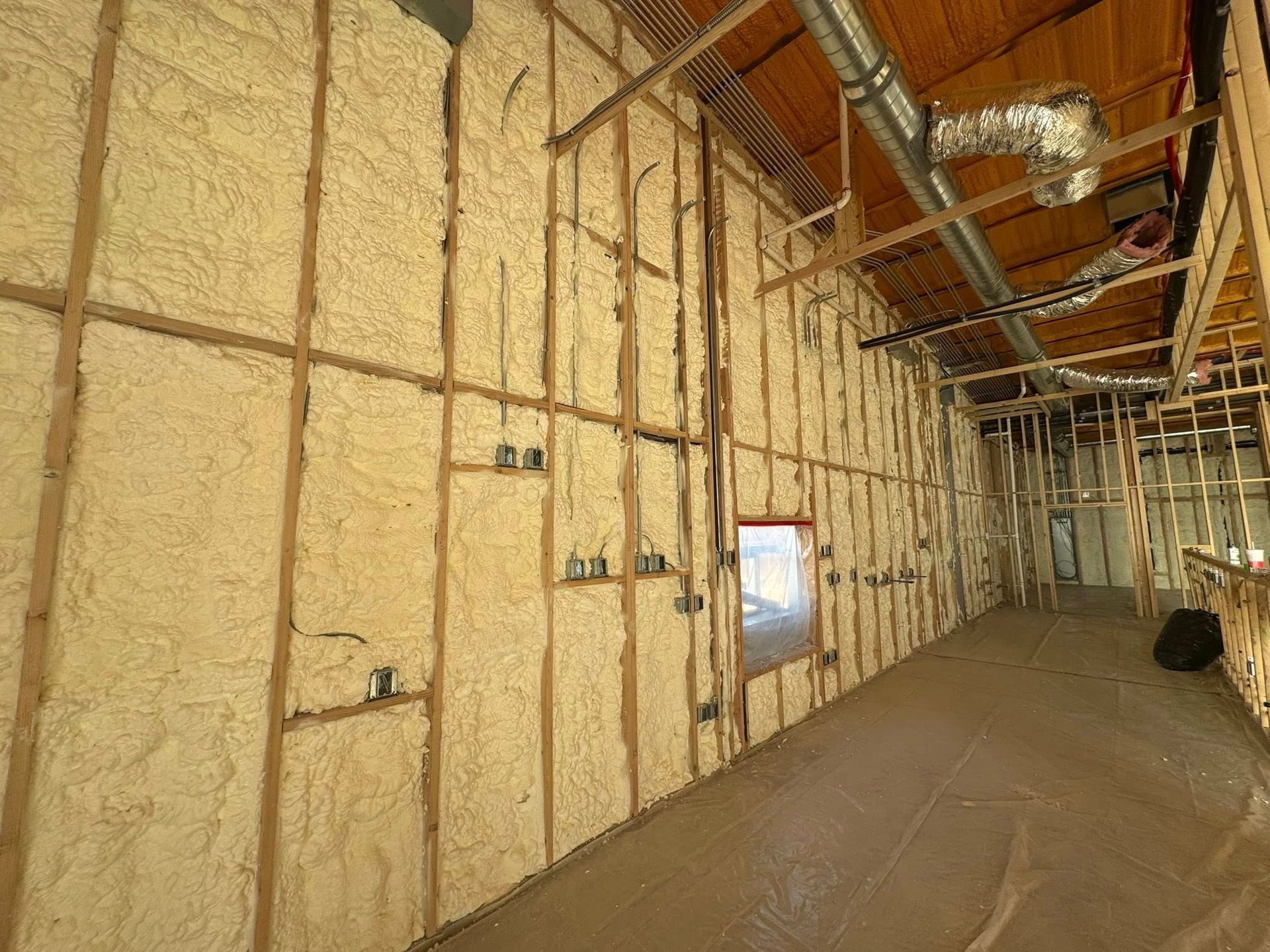 A large room with a lot of insulation on the walls and ceiling.